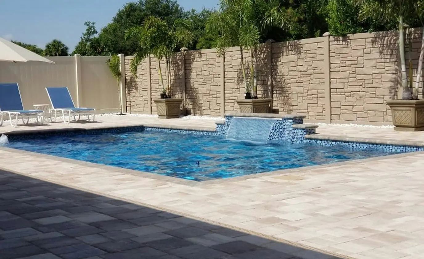 Custom pool water feature by Heavenly Outdoor in Bunker Hill, Texas