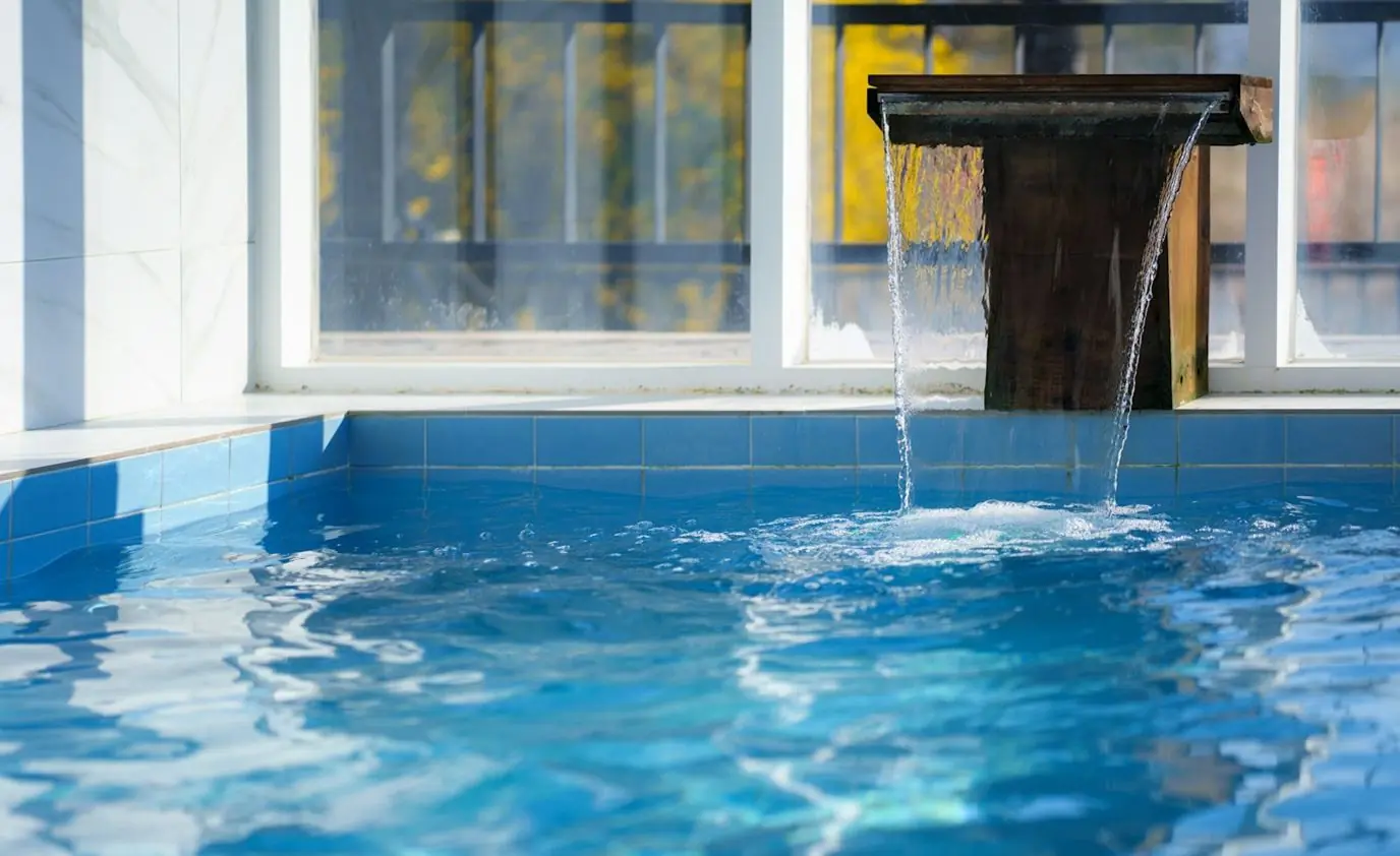 Custom pool water feature by Heavenly Outdoor in Sugar Land, Texas
